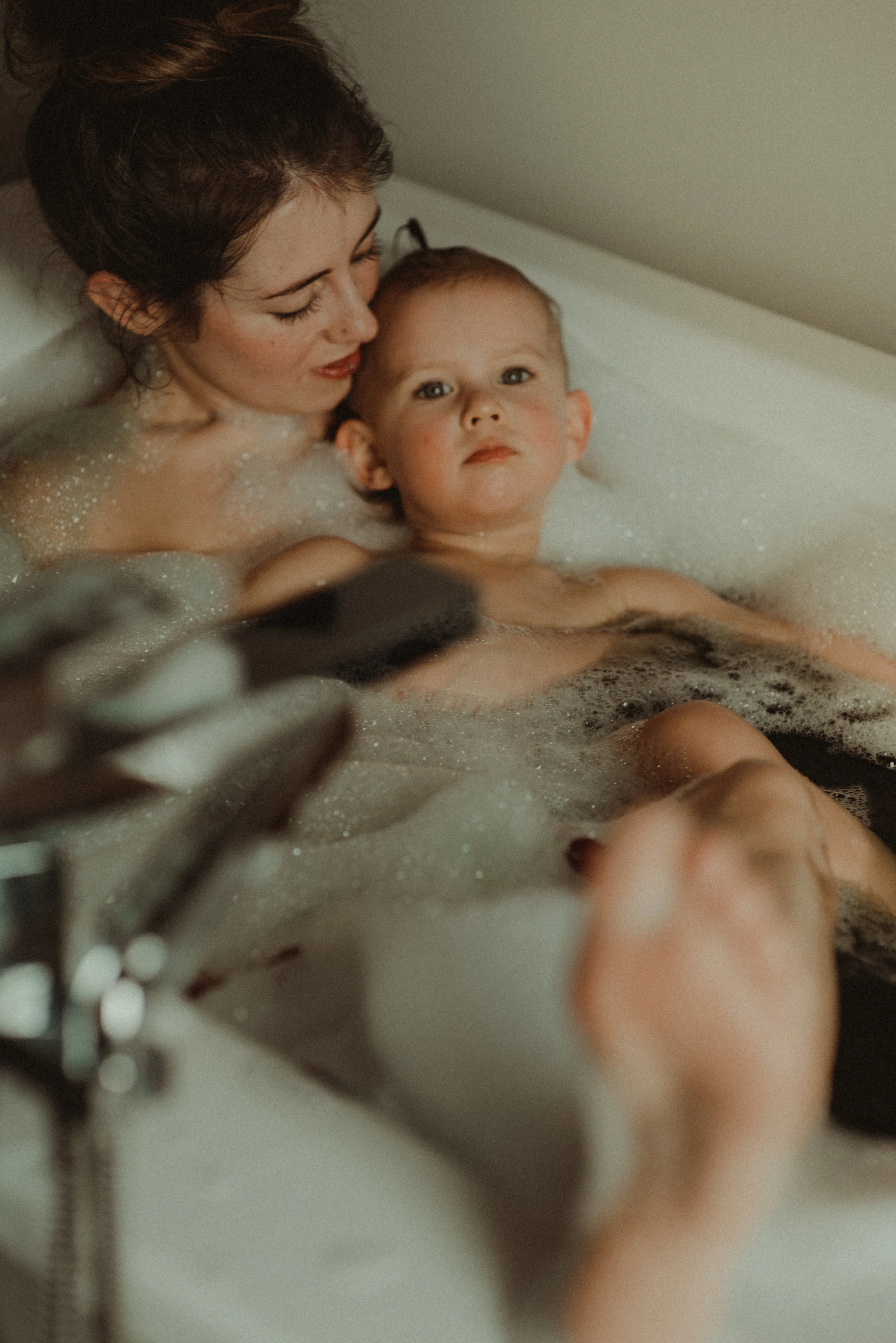 Mother top daughter bathing